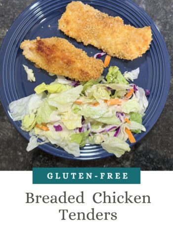 This image is of crispy chicken tenders with a side of salad.