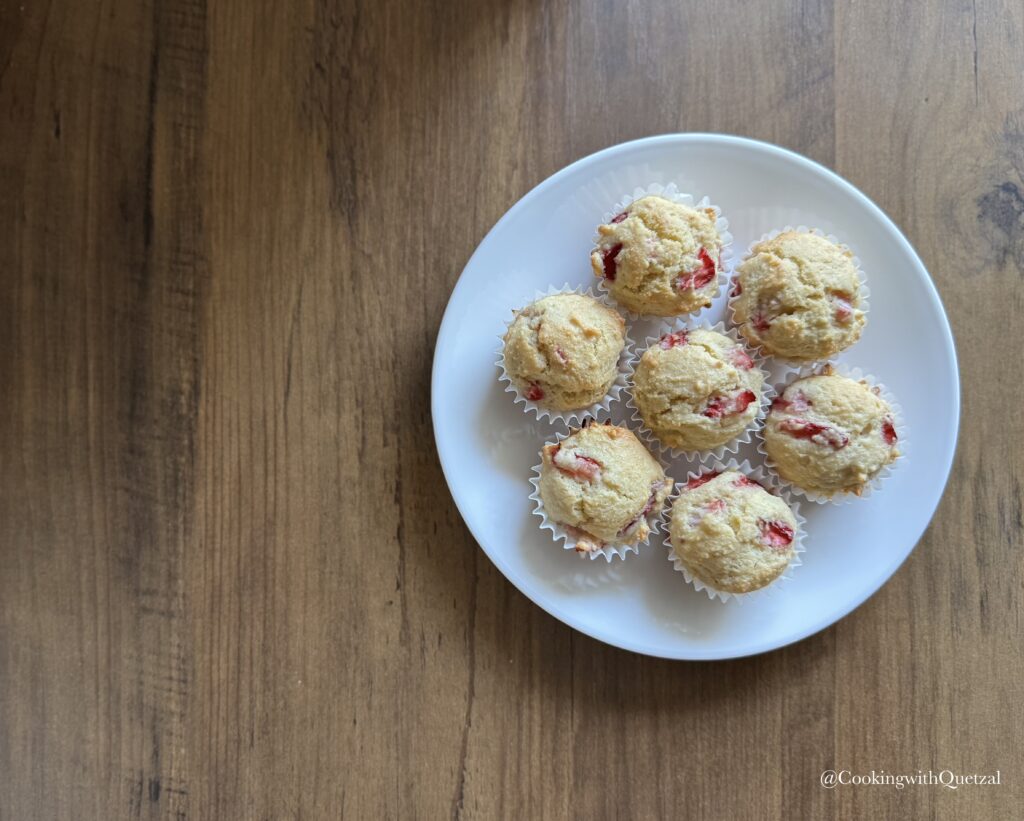 This is a zoomed out image of baked gluten free strawberry almond muffins