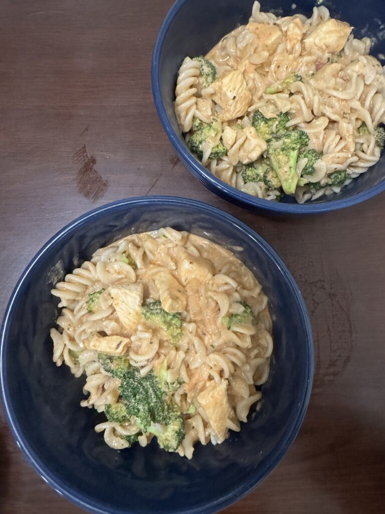 This image is of 2 bowls of gluten free creamy rotini pasta.